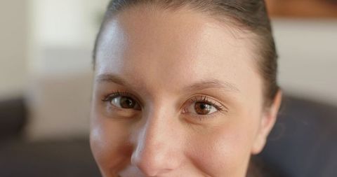Closeup african american woman smiling with warm eyes natural makeup lifestyle portrait