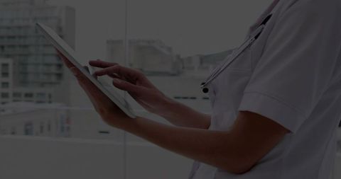 Medical Professional Using Tablet for Digital Healthcare Insights