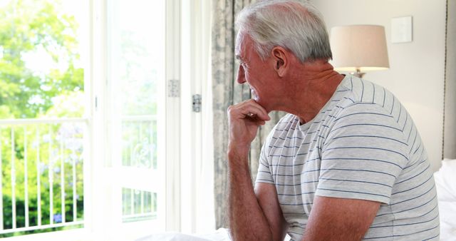 Senior Man Sitting on Bed Pondering at Home - Download Free Stock Images Pikwizard.com