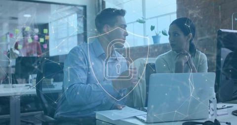 Business Colleagues Collaborating with Digital Security Overlay