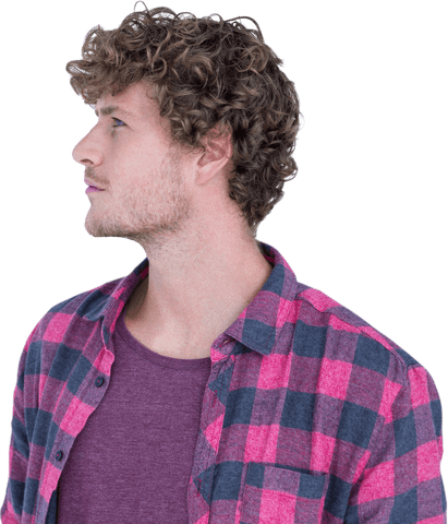 Curly haired man in transparent flannel shirt gazing sideways
