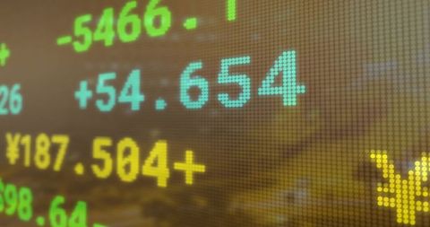 Digital Market Ticker Displaying Stock Market Figures in Harbor Setting