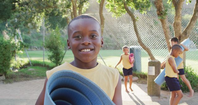 Happy Young Boy Holding Yoga Mat at Outdoor Fitness Class - Download Free Stock Images Pikwizard.com