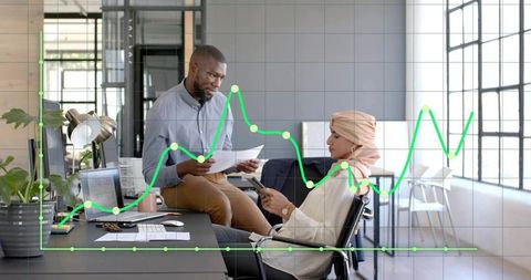 Office Team Analyzing Financial Data with Modern Technology