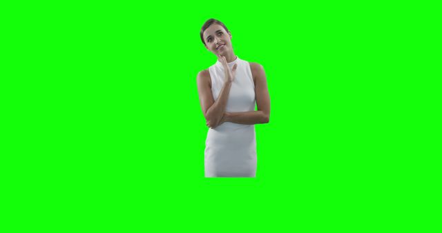 Woman standing and thinking with hand on chin, isolated on green screen background. Ideal for projects requiring an easily editable background or for use in various advertisements, brochures, presentations, or digital content that needs a contemplative or thoughtful pose.