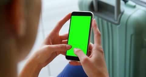 Woman Texting on Smartphone at Airport with Luggage - Download Free Stock Images Pikwizard.com