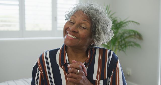 African american senior woman smiling at camera. active and healthy retirement lifestyle at home.