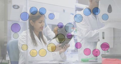 Scientist Reviewing Tablet in Advanced Research Laboratory