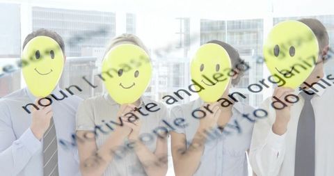 Business team holding smiley masks in office with projected text overlay for corporate