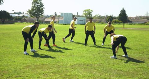 Youth team training outdoors in yellow jerseys