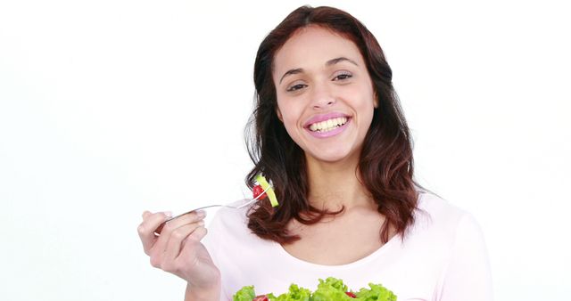 Smiling Woman Eating Fresh Salad and Promoting Healthy Lifestyle - Download Free Stock Images Pikwizard.com