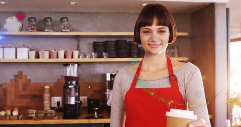 Smiling Barista Serving Coffee in Cozy Cafe