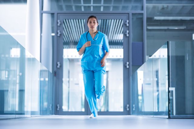 Nurse running in hospital corridor during emergency