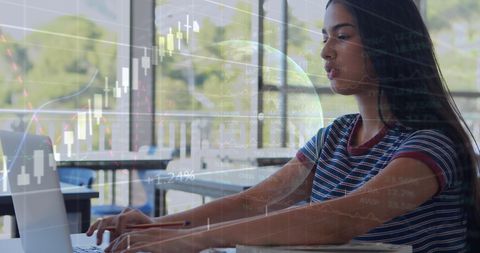 Student studies data charts with global technology in classroom