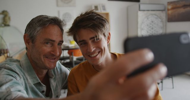 Happy Father and Son Taking Selfie at Home - Download Free Stock Photos Pikwizard.com