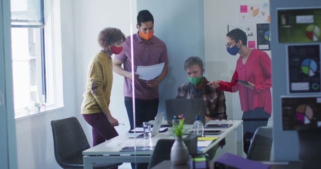 Diverse Business Team Collaborating with Masks in Office Meeting - Download Free Stock Images Pikwizard.com