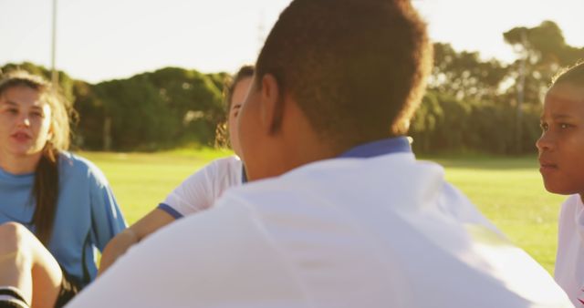 Young Soccer Players Sitting in Circle on Sunny Day - Download Free Stock Images Pikwizard.com