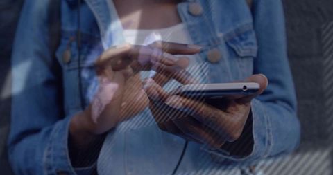 Close-up of Person Using Smartphone in Casual Denim Jacket