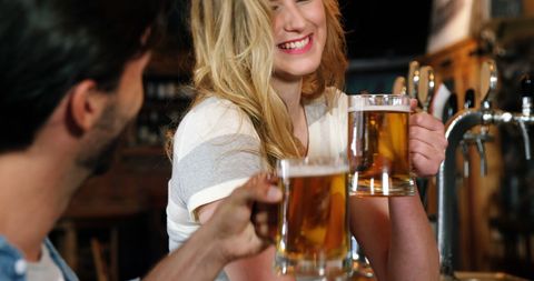 Lively Friends Enjoying Beer at Pub Counter - Download Free Stock Images Pikwizard.com