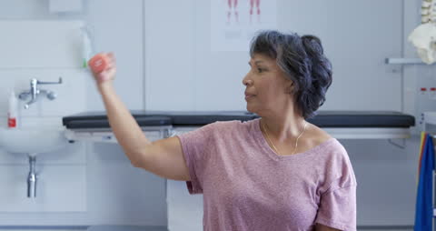 Rehabilitation Exercise with Dumbbell in Physiotherapy Session