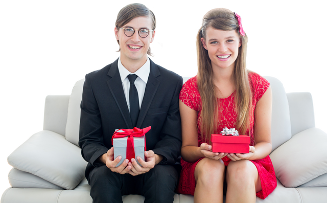 Cute Geeky Couple Smiling and Holding Gift Boxes With Red Ribbons - Download Free Stock Videos Pikwizard.com