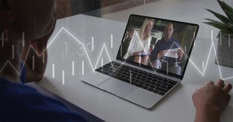 Colleagues collaborating virtually with graph overlay