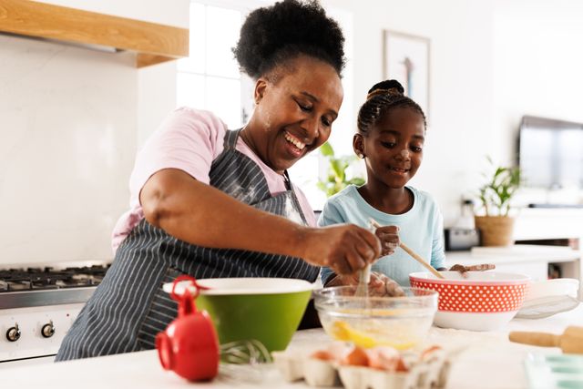 Grandmother and Granddaughter Cooking Together in Kitchen - Download Free Stock Images Pikwizard.com