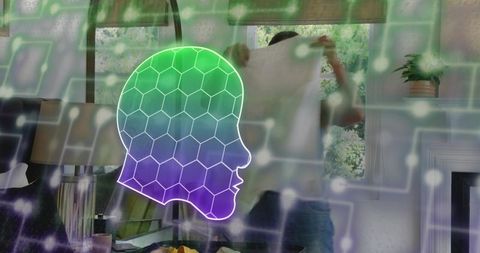 Glowing holographic head hovering in living room while man folding shirt, smart home concept