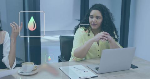 Diverse Colleagues In Meeting with Ecology Icons Overlay