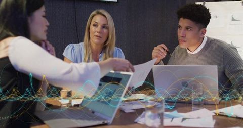 Diverse Team Discussing Business Projects with Digital Interference Effect