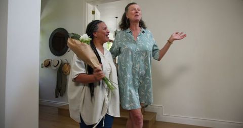 Warm homecoming: joyful greeting with flowers