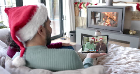 Family Enjoying Christmas Video Call with Parents