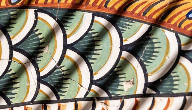 Displaying hand-painted ceramic tile repeating scallop motif with crackle glaze and shadows