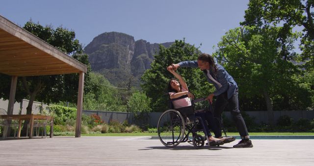 Young Man and Woman in Wheelchair Dancing Outdoors - Download Free Stock Images Pikwizard.com