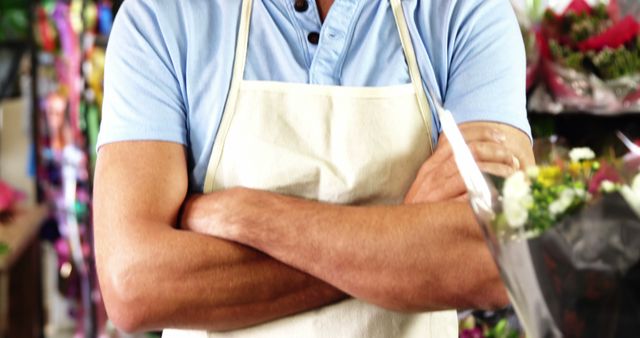 Florist Wearing Apron with Arms Crossed in Flower Shop - Download Free Stock Images Pikwizard.com