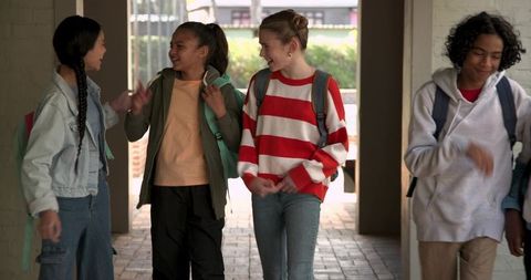 Diverse Group of Students Walking and Chatting Outdoors