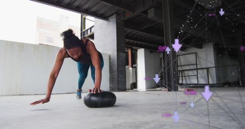 Athletic Woman Performing Push-Up on Medicine Ball with Digital Graphics