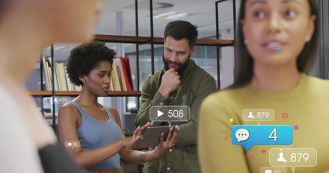 Diverse Team Discussing Social Media Strategy in Modern Office