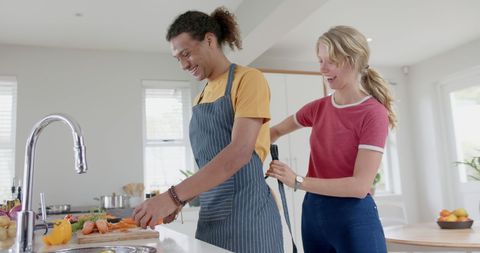 Happy Couple Cooking Together in Modern Home Kitchen