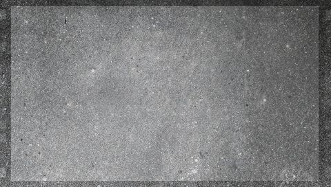 Weathered concrete panel with dark framed border and speckled gray texture