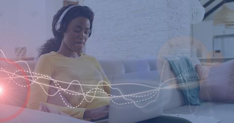 woman analyzing music data with headphones - Download Free Stock Images Pikwizard.com
