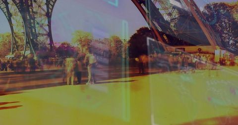 Tourists Exploring Eiffel Tower with Neon Augmented Reality Overlay