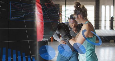 Female boxer training with coach using augmented reality performance analytics overlay