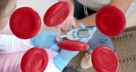 Caregiver checking blood glucose with glucometer and floating red blood cells