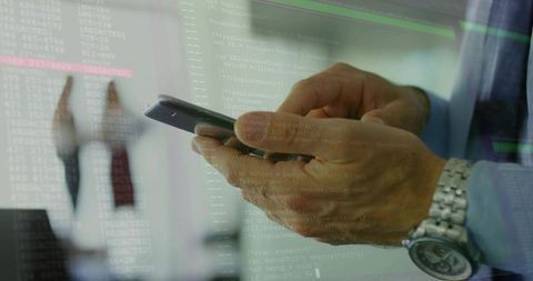 Executive Holding Smartphone with Code Overlay Mobile Development and Corporate Security