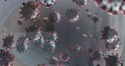 Coronavirus particles floating inside respiratory droplet with protective mask reflection