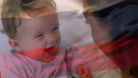 Russian Flag Overlapping Mother Playing with Baby at Home