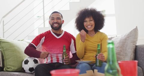 Excited Couple Cheering Sports Victory at Home - Download Free Stock Images Pikwizard.com