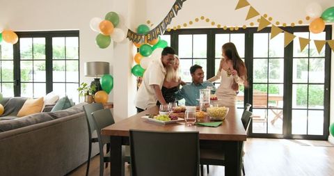 Diverse Friends Celebrating Birthday Party in Bright Living Space