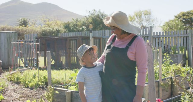 Smiling Grandmother and Grandson Enjoying Time in Garden - Download Free Stock Images Pikwizard.com